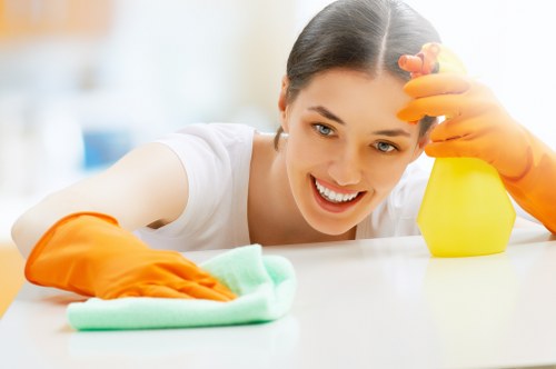 Local stain removal technician working in an Ealing home or office
