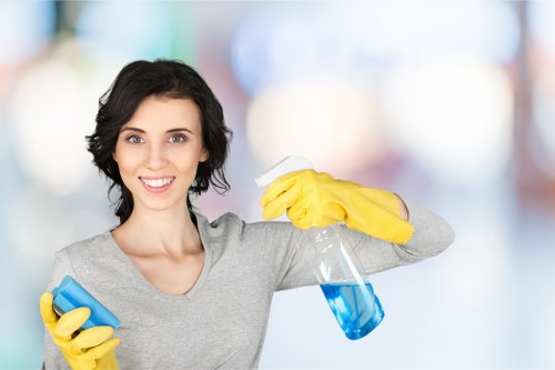 Cleaning staff using protective gloves during chemical handling
