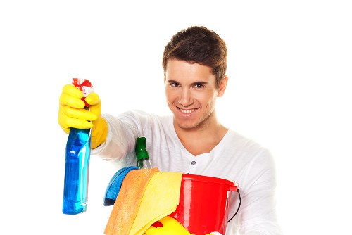 Cleaner reaching upper-floor windows on a local Ealing property